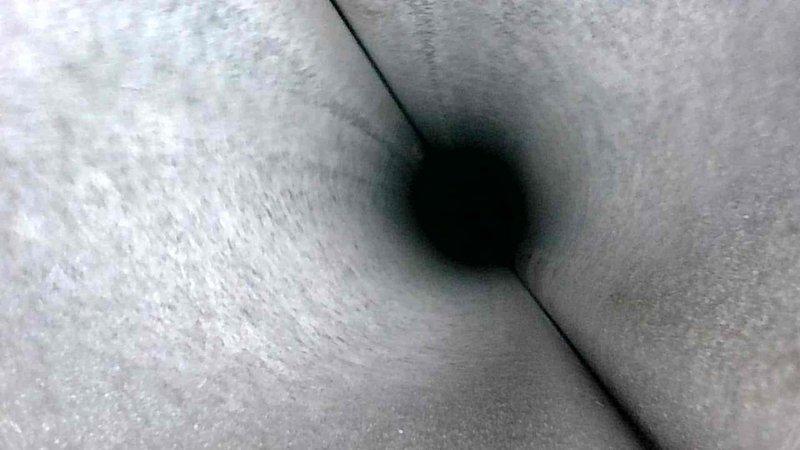 Performed routine HVAC tune-up service, including visual inspection of ductwork system. Documented moderate dust accumulation in ventilation shafts with some visible seam integrity concerns. Interior duct examination revealed minor sooting and potential particulate buildup requiring future attention, particularly near junction points.