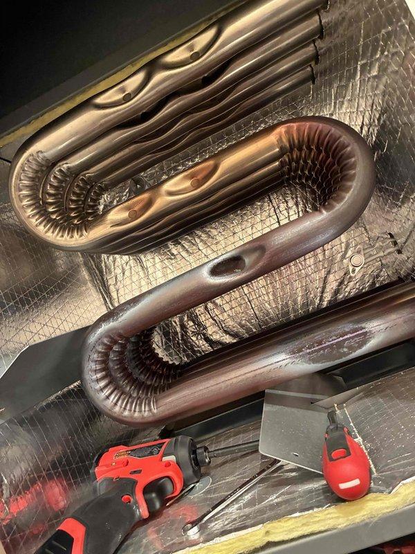 Performed routine maintenance on HVAC system including inspection of copper heat exchange coils with finned tubing. Verified proper operation of the Honeywell digital thermostat which was correctly maintaining temperature at 68°F. System appears to be functioning within normal parameters.