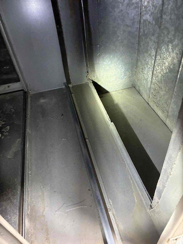 Completed routine HVAC tune-up service which included inspection of system components. Examined and documented condition of the pleated air filter, noting moderate dust accumulation in the filter pleats. Inspected interior galvanized metal ductwork for integrity, finding the main junction and access panel in serviceable condition with normal wear.