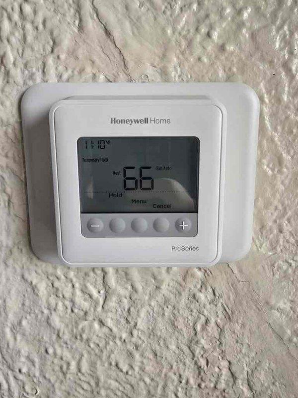 Successfully installed a new furnace system with complete ducting connection, including proper transition to the existing horizontal round duct. Set up and programmed a Honeywell Home ProSeries thermostat for temperature control with temporary hold and auto fan capabilities. Installation included all necessary electrical connections and proper condensate drainage setup.