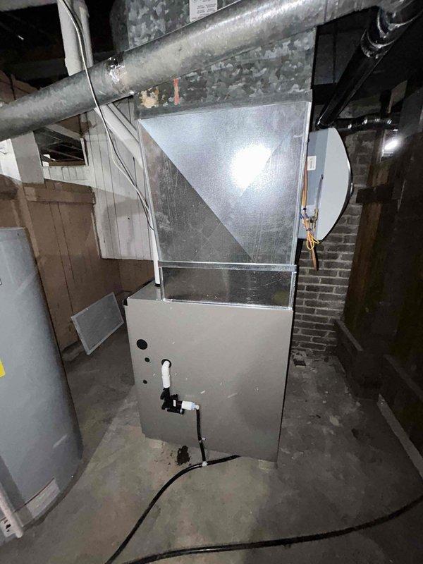 Successfully installed a new furnace system with complete ducting connection, including proper transition to the existing horizontal round duct. Set up and programmed a Honeywell Home ProSeries thermostat for temperature control with temporary hold and auto fan capabilities. Installation included all necessary electrical connections and proper condensate drainage setup.