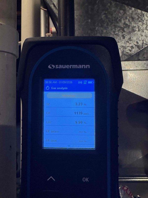 Performed diagnostic gas analysis on heating system using Sauermann analyzer, which detected elevated carbon monoxide (CO) levels between 927-1139 ppm, indicating combustion issues. Oxygen levels measured at 3.23-3.61% with CO₂ readings around 9.7-9.9%, suggesting improper air-fuel mixture requiring adjustment or possible heat exchanger inspection.