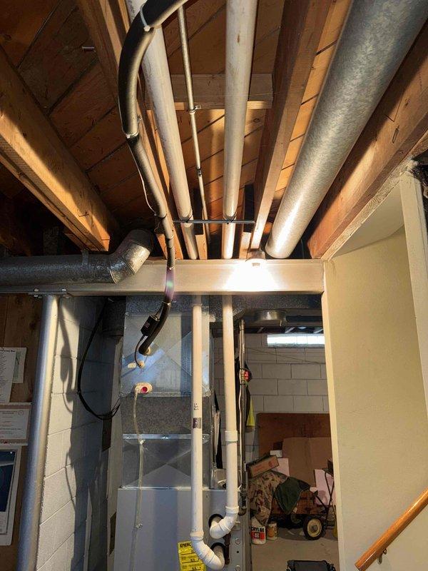 Conducted thorough inspection of basement HVAC and ductwork system. Identified aging galvanized metal ducts with potential airflow restrictions and recommended replacement. Evaluated existing mechanical equipment mounted against concrete block wall for compatibility with new ductwork configuration.