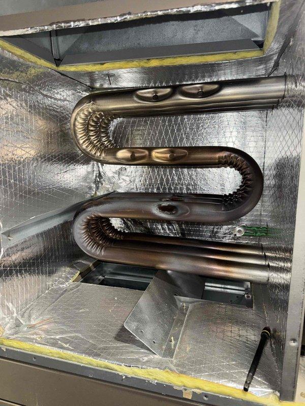 Completed tune-up service on Goodman HVAC system. Inspected heat exchanger and found it in good condition with no cracks or corrosion. Checked system efficiency against EnergyGuide specifications and confirmed proper operation. All components functioning normally with no issues requiring repair.