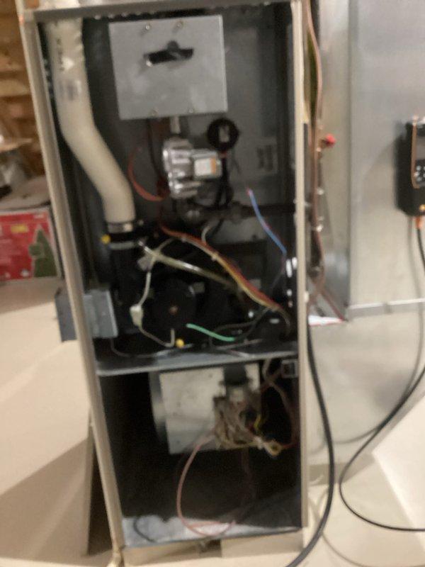 Performed comprehensive tune-up of residential HVAC system. Inspected electrical connections and wiring in control panel, noting some disorganization that was subsequently corrected. Examined blower motor assembly and internal components for proper operation, ensuring all wire connections were secure and properly terminated.