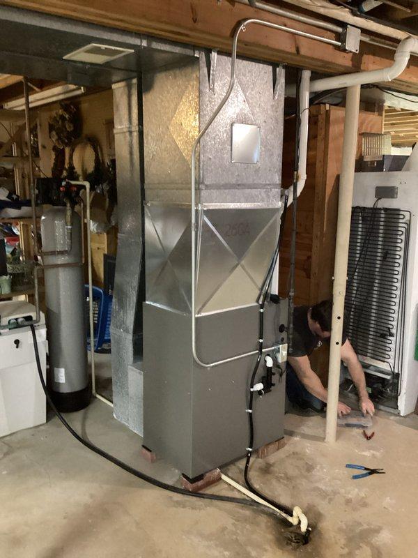 Successfully installed a new residential furnace system in basement utility room. Unit was properly secured and connected to existing ductwork with proper X-bracing. All PVC venting, condensate lines, and electrical connections were completed according to manufacturer specifications.