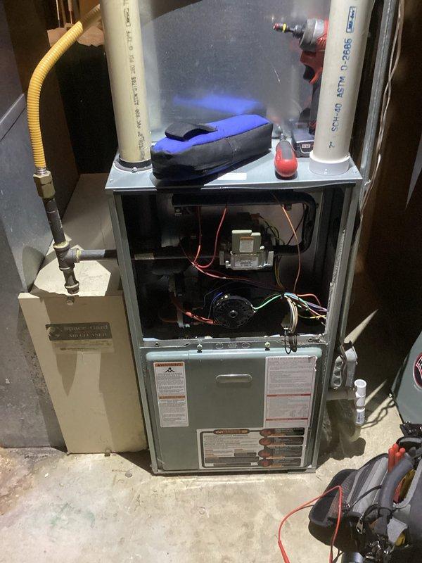 Completed comprehensive tune-up and maintenance of residential HVAC system in basement utility area. Inspected furnace internal components (control board, motor, wiring) with front panel removed for thorough examination. Evaluated gas line connection and PVC exhaust/intake pipes, along with associated drainage and condensate removal system to ensure proper function and prevent potential issues.