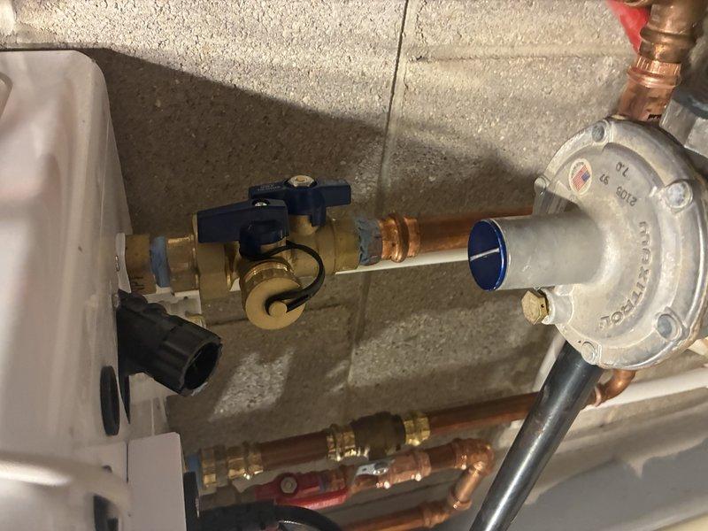 Replaced worn pressure regulator valve and installed new shut-off valve on copper supply line. Performed soldering work on connection points and verified proper system pressure after installation. All connections tested for leaks with system operational.