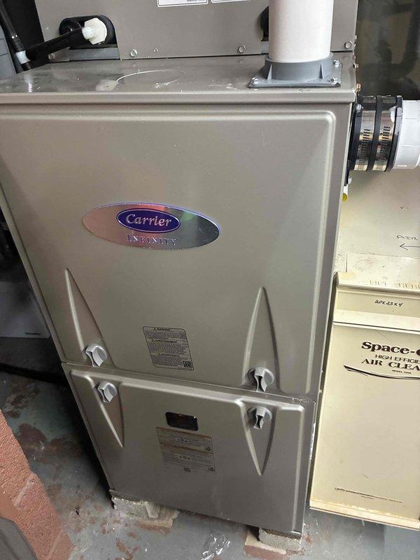 Performed seasonal tune-up on Carrier Infinity furnace system. Inspected filter which was clean and properly seated in housing. Checked all system components including furnace cabinet, connection points, and adjacent air cleaner. All equipment in good working condition with no issues identified.