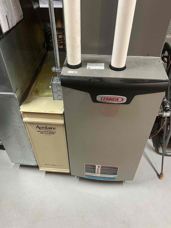 Performed routine tune-up service on a Lennox HVAC system with attached Aprilaire whole-home humidifier. Inspected furnace components, intake/exhaust venting, and humidifier functionality. Noted minor oxidation developing at one connection point but system is currently operating within normal parameters.
