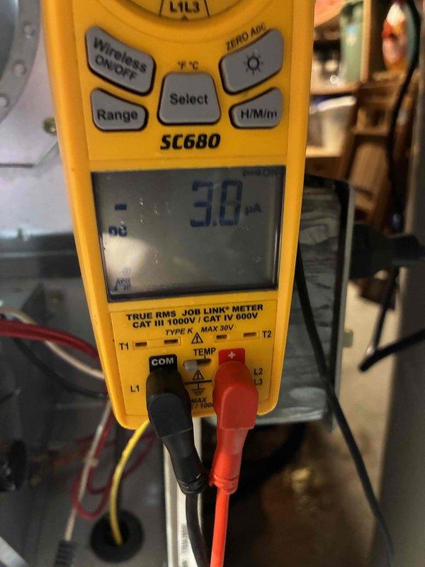 Performed annual preventive maintenance on a residential Carrier furnace unit located in the basement mechanical room. Conducted full electrical diagnostic testing with SC680 multimeter, checking amperage readings (3.0 mA) to verify proper component operation. Visual inspection revealed system to be in normal operating condition with no visible damage or anomalies to the furnace or connected ventilation components.