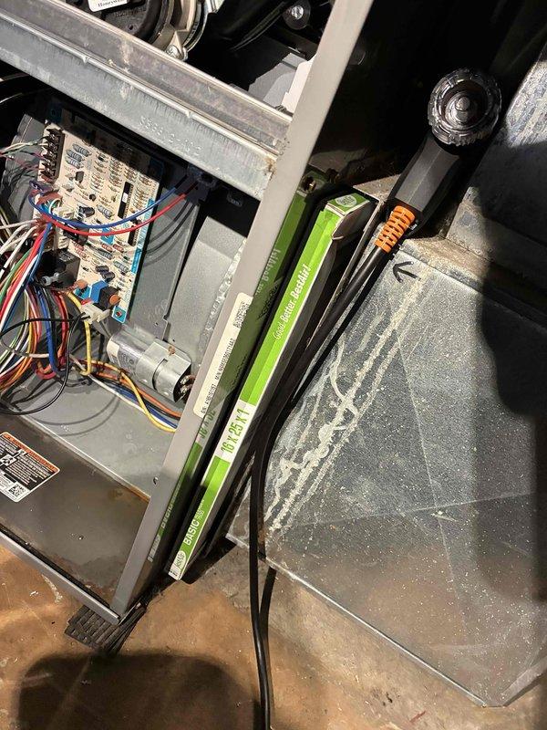 Performed routine preventative maintenance on HVAC system including inspection of control board and electrical components. Tested amperage draw with clamp meter, recording 3.7 amps which is within manufacturer specifications. Inspected and verified proper condition of Type A air filter; some dust accumulation noted on system components but not affecting performance.