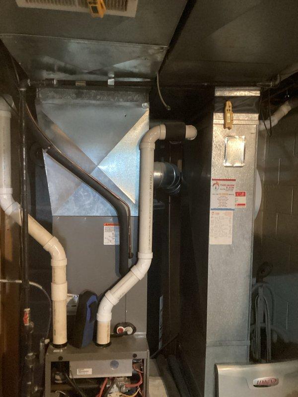 Performed comprehensive tune-up service on Lennox furnace system with integrated PureAir Air Purification component. Inspection revealed all internal electrical components, wiring connections, and mechanical parts in normal working condition with no signs of damage or deterioration. Verified proper operation of drainage system, including PVC piping and connections, and confirmed appropriate airflow through ductwork.