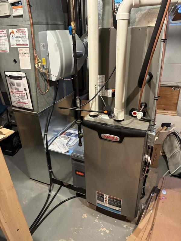 Performed full inspection and combustion analysis on Lennox furnace system. Gas analyzer readings showed CO levels at 255 ppm and CO AF at 611 ppm, with combustion efficiency at 96.0%. System includes proper PVC exhaust/intake ventilation and additional air quality component installed alongside main furnace unit.