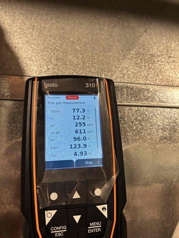 Performed full inspection and combustion analysis on Lennox furnace system. Gas analyzer readings showed CO levels at 255 ppm and CO AF at 611 ppm, with combustion efficiency at 96.0%. System includes proper PVC exhaust/intake ventilation and additional air quality component installed alongside main furnace unit.