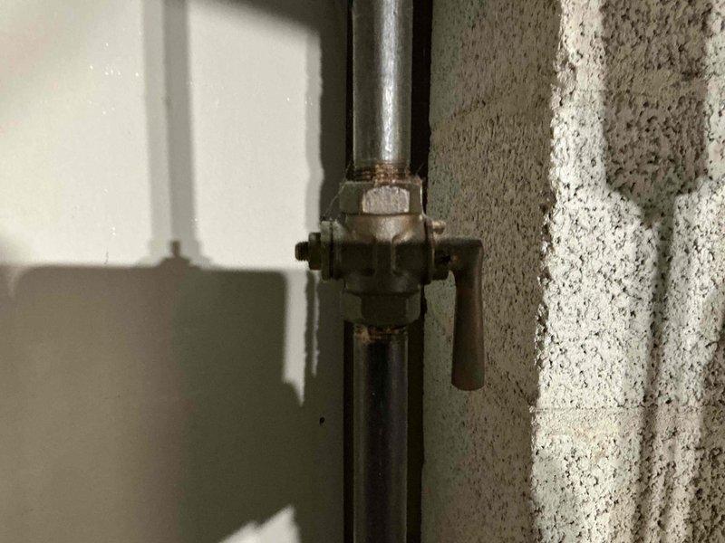 Conducted detailed assessment of existing water heater system and associated plumbing connections in utility area. Documented valve assembly condition, noting minor corrosion at connection points. Recommended replacement of aging components to prevent potential leaks and ensure optimal system performance.