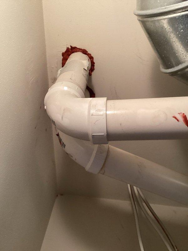 Responded to callback regarding improperly sealed condensate drain lines. Upon inspection, identified excessive red PVC cement/primer around pipe connections causing wall staining. Cleaned affected areas, resealed connections properly, and verified drainage system functionality.