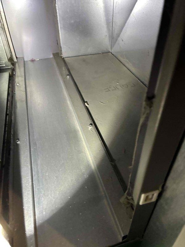 Performed comprehensive tune-up service on HVAC system, inspecting the interior metal enclosure for signs of wear. Documented unit serial number (0511 N1) and examined access panels and ventilation features. System exhibited normal operational wear with no significant issues detected.