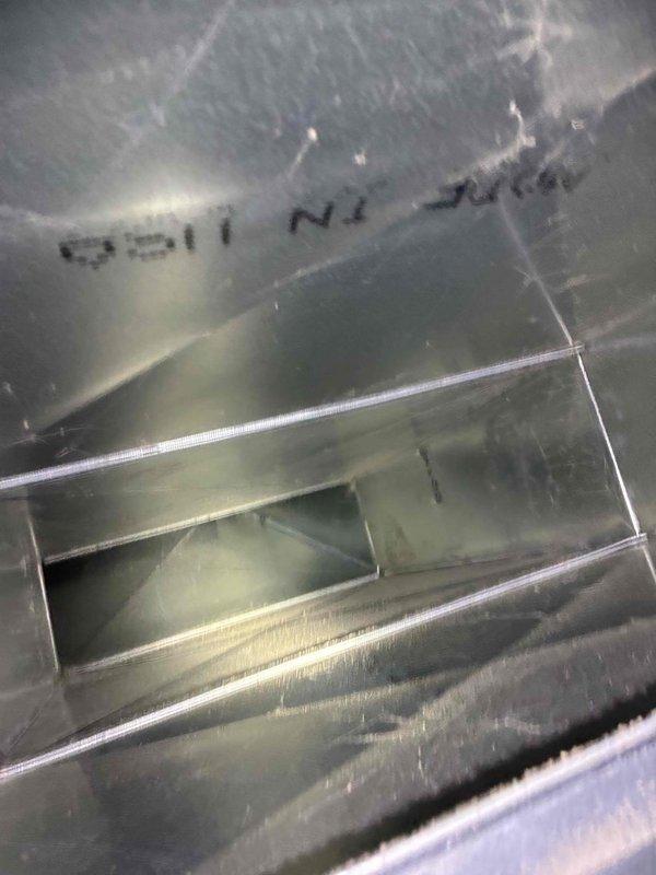 Performed comprehensive tune-up service on HVAC system, inspecting the interior metal enclosure for signs of wear. Documented unit serial number (0511 N1) and examined access panels and ventilation features. System exhibited normal operational wear with no significant issues detected.