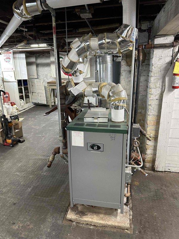 Completed comprehensive inspection of existing HVAC system in basement mechanical room, including furnace/boiler unit with extensive ductwork, water heater, and expansion tank. Documented current equipment condition showing normal wear on the aging system and evaluated ductwork insulation integrity. Prepared replacement estimate for complete system upgrade to improve efficiency and reliability.