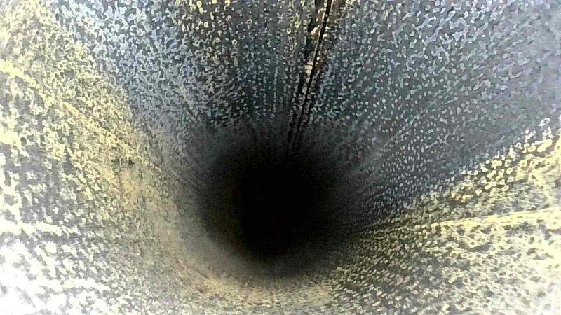 Performed scheduled maintenance service on HVAC system. Conducted thorough inspection of ductwork, noting moderate dust accumulation and residue buildup on interior surfaces. Measured airflow and temperature at registers using UEi digital meter, confirming system is operating within normal parameters despite minor airflow restriction.