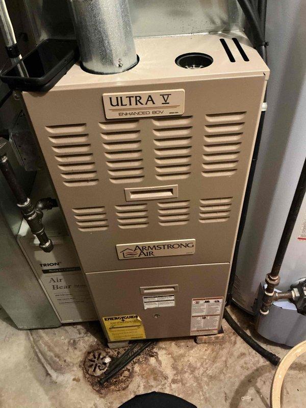Performed routine tune-up on Armstrong Air Ultra V Enhanced ECV furnace system. Inspected all components including exhaust venting, copper line connections, and system controls. Unit appears to be functioning correctly with no visible issues detected. Recommended continued annual maintenance to maintain optimal efficiency and extend system lifespan.