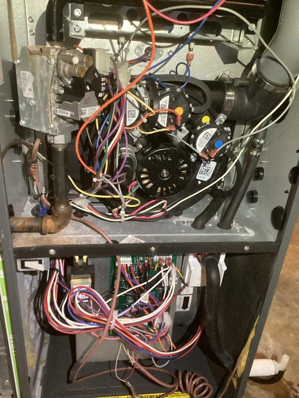 Performed comprehensive tune-up on HVAC system, inspecting electrical components and connections. Examined blower motor assembly and circuit board, verifying proper wire connections and component functionality. All mechanical parts were inspected and confirmed to be operating within normal parameters.