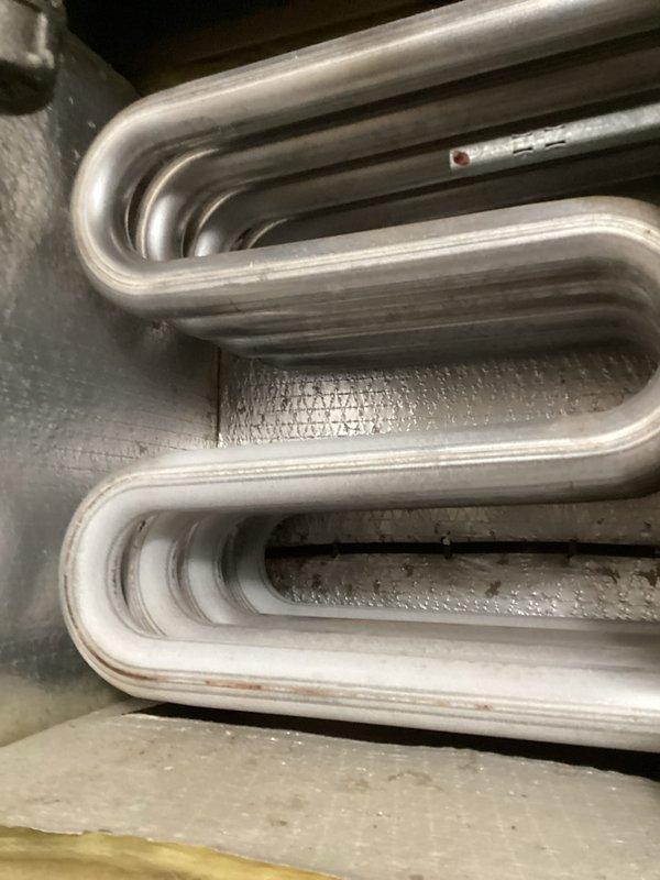 Performed routine HVAC tune-up service, inspecting system components and connections. Noted minor dust accumulation in the air duct connection with early signs of rust formation along metal seams. Examined cooling coils which showed slight discoloration and minor corrosion but remain in functional condition.