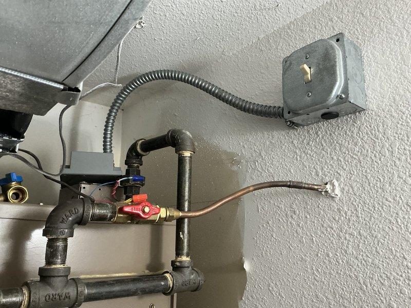 Conducted inspection of existing HVAC system installation, focusing on air handler mounting and plumbing connections. Documented current configuration including wall clearance and electrical junction box setup. Prepared estimate for complete system replacement with attention to proper fitting of equipment against interior wall and reconnection of existing plumbing with appropriate valves and conduit routing.