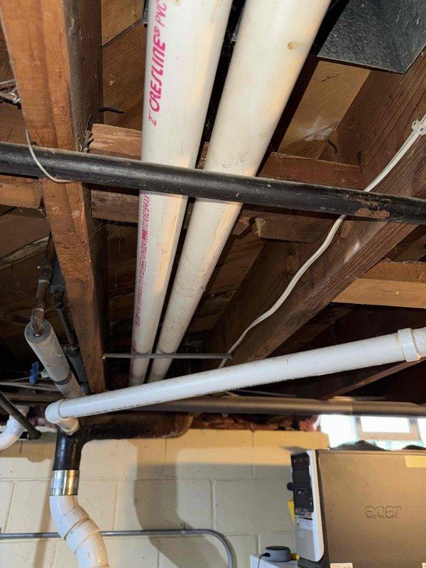 Conducted comprehensive inspection of existing Lennox HVAC system in basement utility area. Documented current installation configuration, including furnace unit, PVC ventilation pipes, ductwork, and air handler components. Evaluated plumbing infrastructure connections and ceiling-mounted PVC piping system for replacement planning purposes.