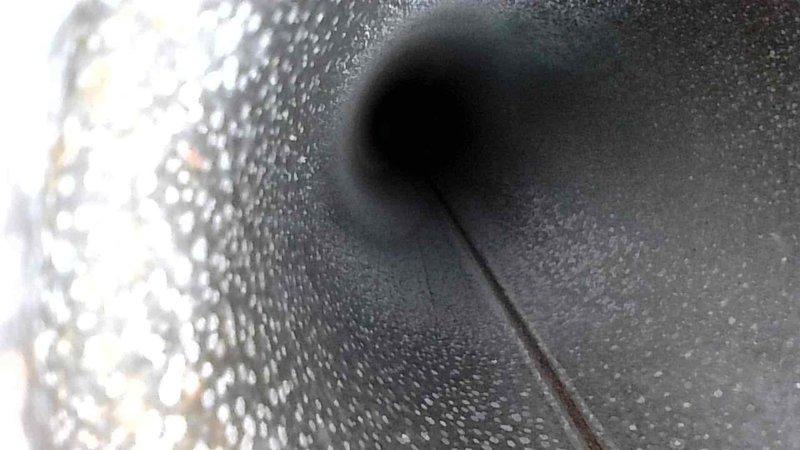 Performed routine maintenance inspection of HVAC ductwork, documenting presence of significant condensation buildup within the ventilation system. Observed and photographed interior duct surfaces showing moisture accumulation and potential early-stage particulate deposits that could impact system efficiency and air quality.