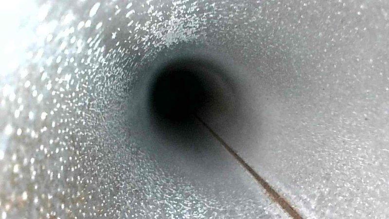 Performed routine maintenance inspection of HVAC ductwork, documenting presence of significant condensation buildup within the ventilation system. Observed and photographed interior duct surfaces showing moisture accumulation and potential early-stage particulate deposits that could impact system efficiency and air quality.