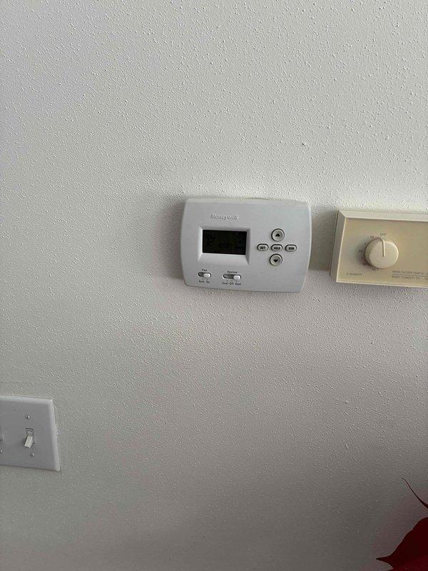 Performed scheduled maintenance visit on residential HVAC system. Inspected Honeywell digital thermostat and control wiring connections, verified proper operation of circuit board components, and ensured all wire connections were secure and properly terminated.