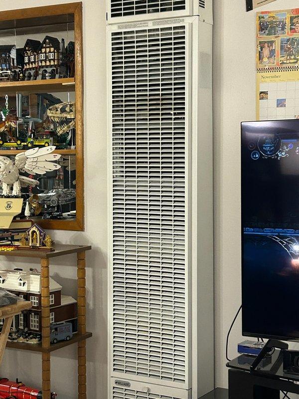 Performed comprehensive tune-up service on wall-mounted HVAC unit. Cleaned and inspected interior components, checked refrigerant levels, and verified proper operation of both heating and cooling functions. Unit is functioning efficiently with no issues detected.