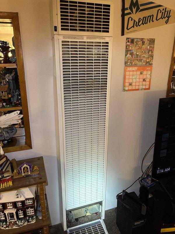 Performed comprehensive tune-up service on wall-mounted HVAC unit. Cleaned and inspected interior components, checked refrigerant levels, and verified proper operation of both heating and cooling functions. Unit is functioning efficiently with no issues detected.