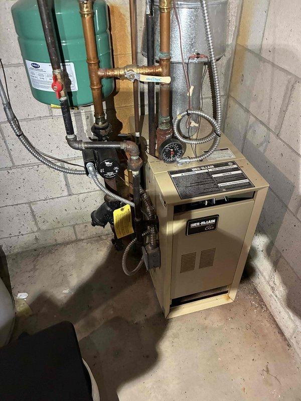 Performed annual tune-up on Weil-McLain propane boiler system. Conducted gas pressure test with TPI 620 manometer, confirming 7.55" WC gas pressure within manufacturer specifications. Inspected expansion tank, pressure gauge, and all copper/metal piping connections for proper operation and signs of leakage; all components functioning correctly.