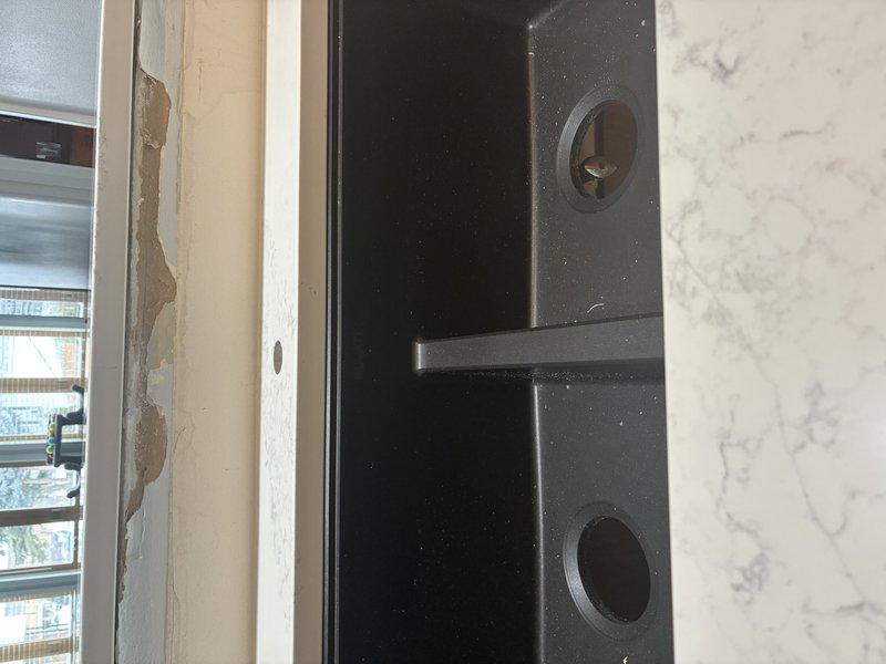 Inspected and repaired plumbing system under cabinet, including replacement of deteriorated P-trap assembly. Installed new PVC drain pipes with proper connections and secured with metal clamps to ensure leak-free operation. Addressed adjacent wall damage near installation area for complete service resolution.