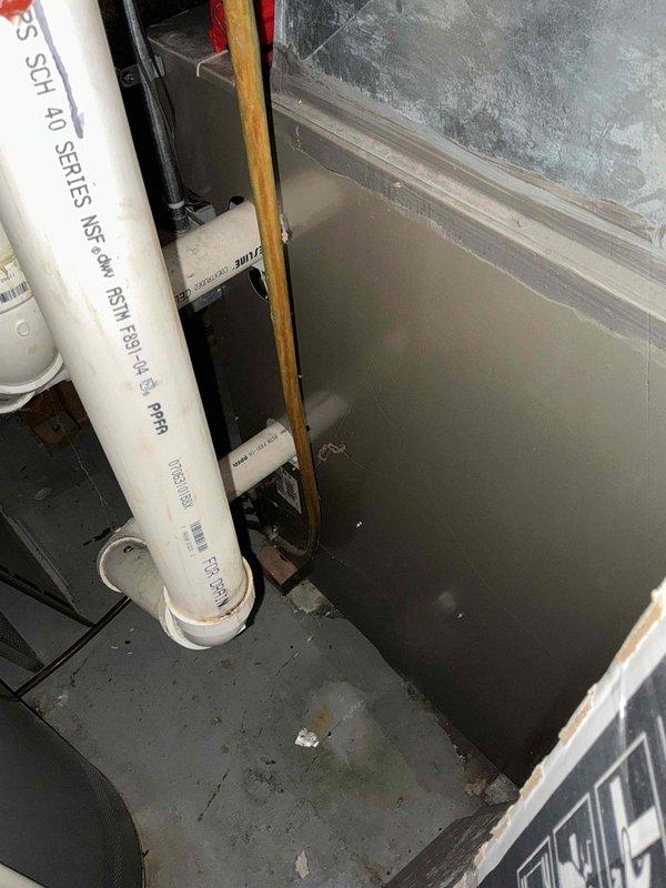 Completed inspection of existing HVAC system and water heater installation in utility room. Observed Richmond water heater with proper PVC venting (SCH 40 series) and evaluated current furnace system with access panel open for component assessment. Documentation photos taken of plumbing connections and mechanical equipment for replacement estimate preparation.