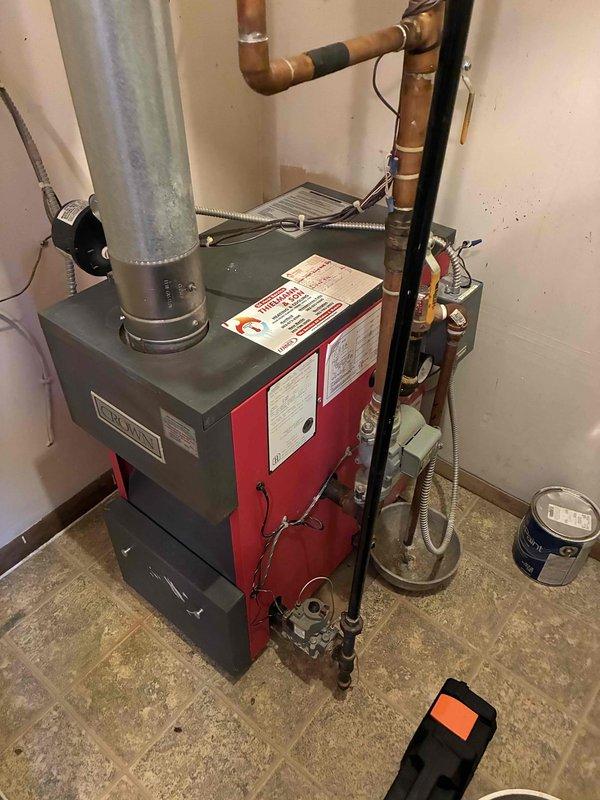 Performed comprehensive tune-up on residential heating system, including inspection of furnace unit, associated copper piping, and ventilation components. Examined ceiling ductwork for proper airflow and identified minor water staining near duct connections. Cleaned system components and verified proper operation of all heating elements.