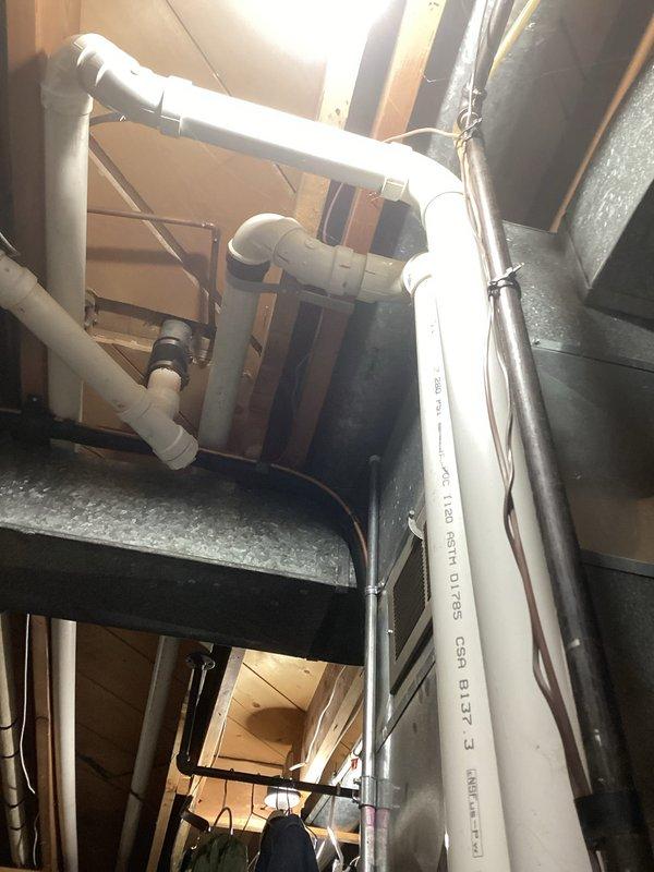 Performed comprehensive tune-up on HVAC system including inspection of blower motor assembly and electrical connections. Verified proper operation of gas valve and control unit with attached flexible gas lines. Examined PVC ventilation piping system in utility area, confirming proper installation and structural integrity of all joints and connections adjacent to ductwork. All components functioning within normal parameters after service.