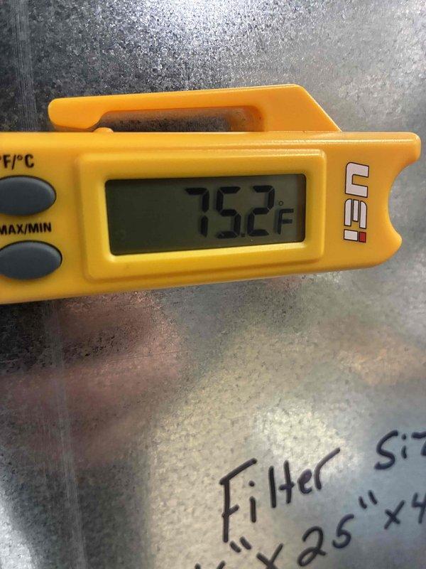 Performed routine prepaid maintenance visit on HVAC system. Conducted electrical testing using SC680 clamp meter, measuring 0.38 A current draw. Verified supply air temperature at 75.2°F using digital thermometer, confirming system is operating within normal parameters.