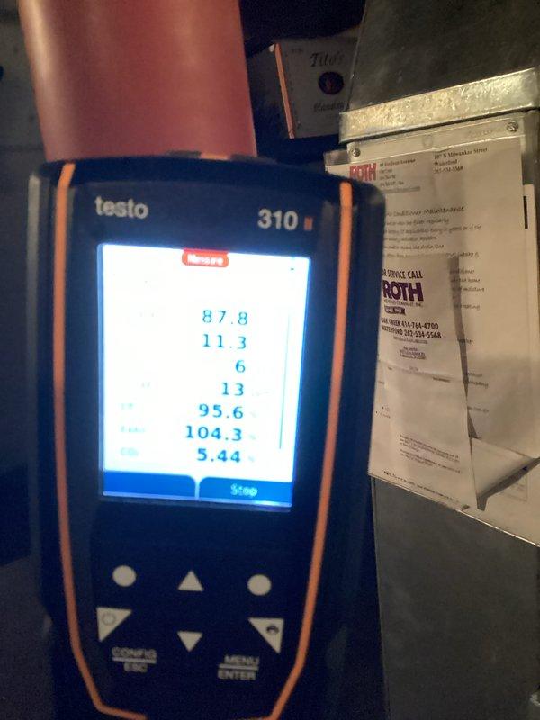 Performed comprehensive tune-up on residential gas furnace including combustion efficiency testing using Testo 310 analyzer, which displayed satisfactory readings for CO2, O2, and efficiency values. Inspected interior components including gas valve assembly, blower motor, and control board connections, confirming proper wire terminations and component functionality. All systems operating within manufacturer specifications after service.