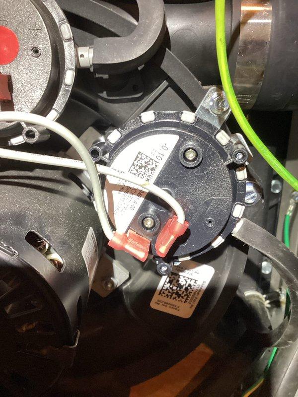 Diagnosed pressure switch malfunction in relatively new furnace causing no-heat condition. Inspected control board connections and blower assembly, finding loose wiring at pressure switch. Reconnected and secured all electrical connections, verified proper operation through complete heating cycle test.