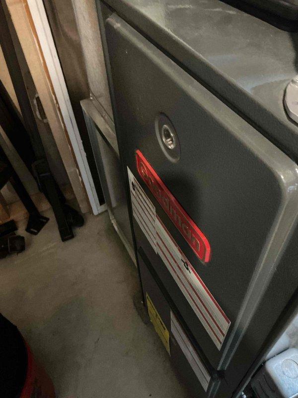 Performed scheduled maintenance on residential HVAC system. Inspected furnace unit with visible service tag and measured supply air temperature (106.5°F) using PDT650 thermometer. System operating within normal parameters with no issues detected.