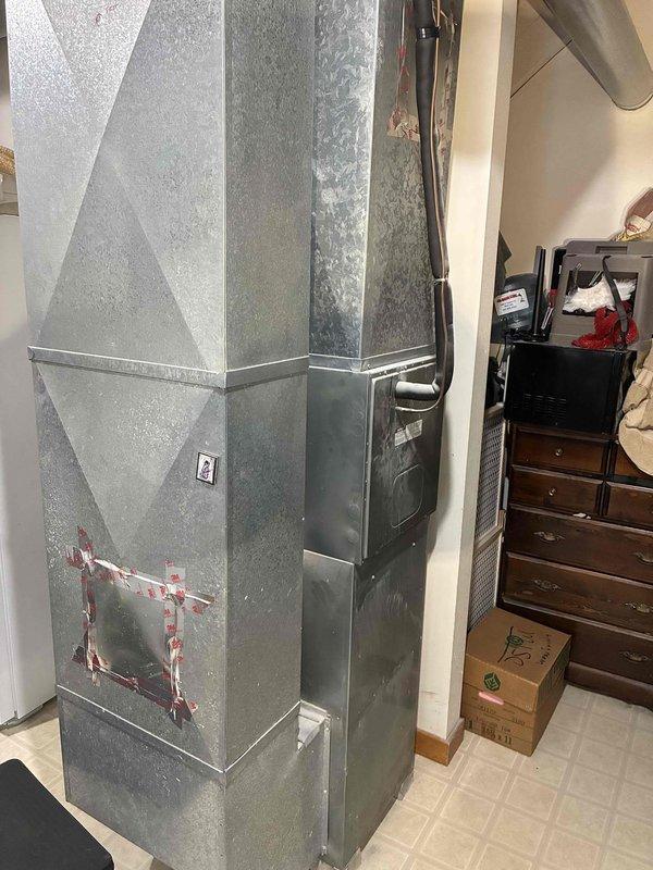 Diagnosed and serviced HVAC system with no heat complaint in residence with system less than 10 years old. Inspection revealed loose connections in ductwork requiring sealing. Applied appropriate tape to secure connection points in metal ductwork to restore proper airflow and system efficiency.