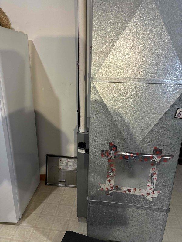 Diagnosed and serviced HVAC system with no heat complaint in residence with system less than 10 years old. Inspection revealed loose connections in ductwork requiring sealing. Applied appropriate tape to secure connection points in metal ductwork to restore proper airflow and system efficiency.