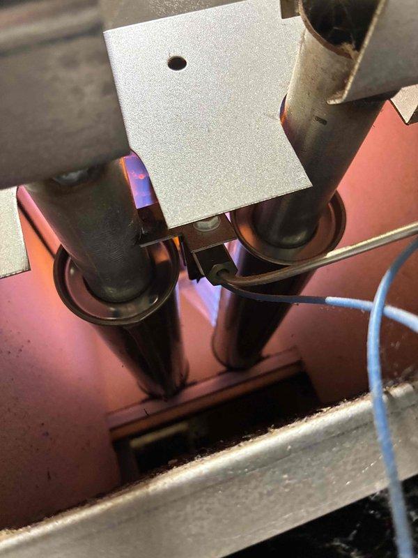 Performed comprehensive tune-up on aging HVAC system. Inspected heat exchanger tubes showing significant heat discoloration and early signs of corrosion. Cleaned burner assembly, verified proper flame pattern, and confirmed secure mounting of mechanical components. System is operational but customer advised that heat exchanger may require replacement within next 1-2 seasons due to visible wear patterns.