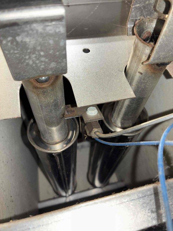 Performed comprehensive tune-up on aging HVAC system. Inspected heat exchanger tubes showing significant heat discoloration and early signs of corrosion. Cleaned burner assembly, verified proper flame pattern, and confirmed secure mounting of mechanical components. System is operational but customer advised that heat exchanger may require replacement within next 1-2 seasons due to visible wear patterns.