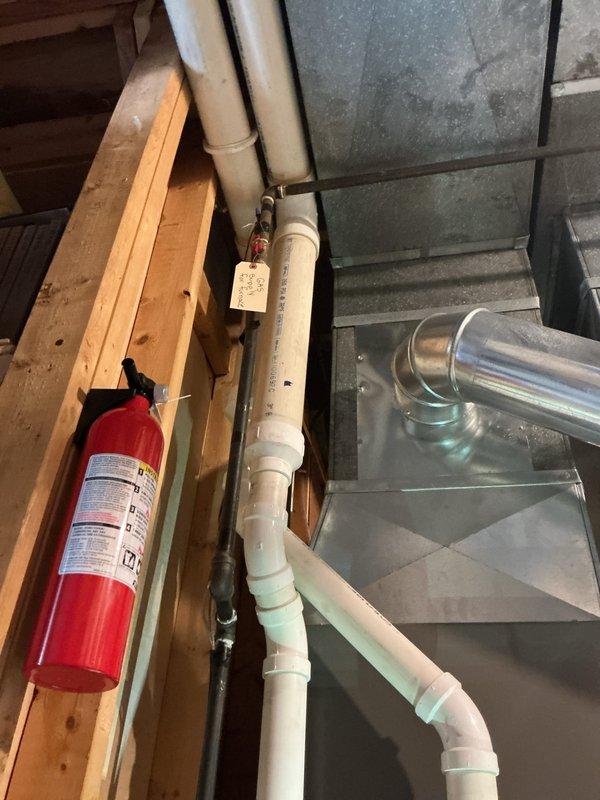 Performed comprehensive HVAC tune-up service including inspection of furnace blower assembly and motor components. Checked electrical connections and verified proper routing of condensate drainage system with PVC piping. System is functioning within manufacturer specifications with no immediate issues detected.