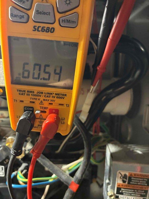 Performed comprehensive HVAC system tune-up including electrical diagnostics with Fieldpiece SC680 multimeter. Measured voltage readings (60.54V) and microamp current (3.4μA) to verify proper electrical operation of control circuits. All system parameters confirmed within manufacturer specifications after service completion.